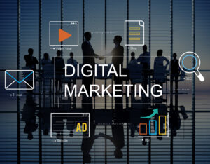An illustration representing what is digital marketing, showing business professionals in a modern office with the words “Digital Marketing” in the center, surrounded by icons for email marketing, video marketing, blogging, SEO, website advertising, and ROI analytics.